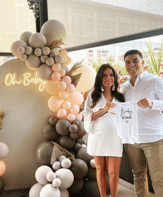 Man Wearing White To A Baby Shower